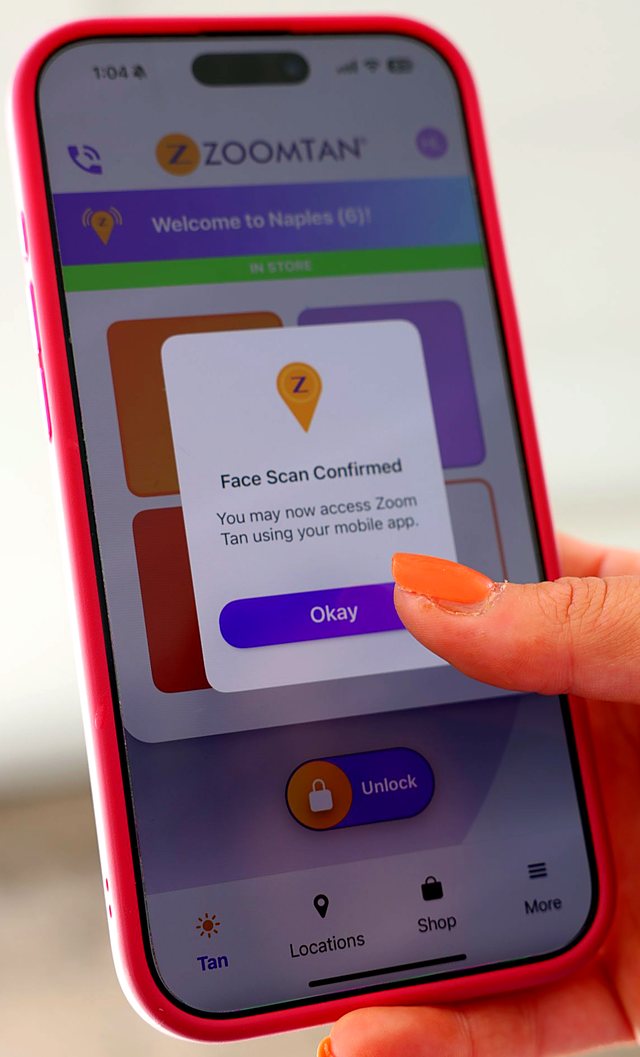 Zoom Tan app showing Face Scan Confirmed with the Unlock button